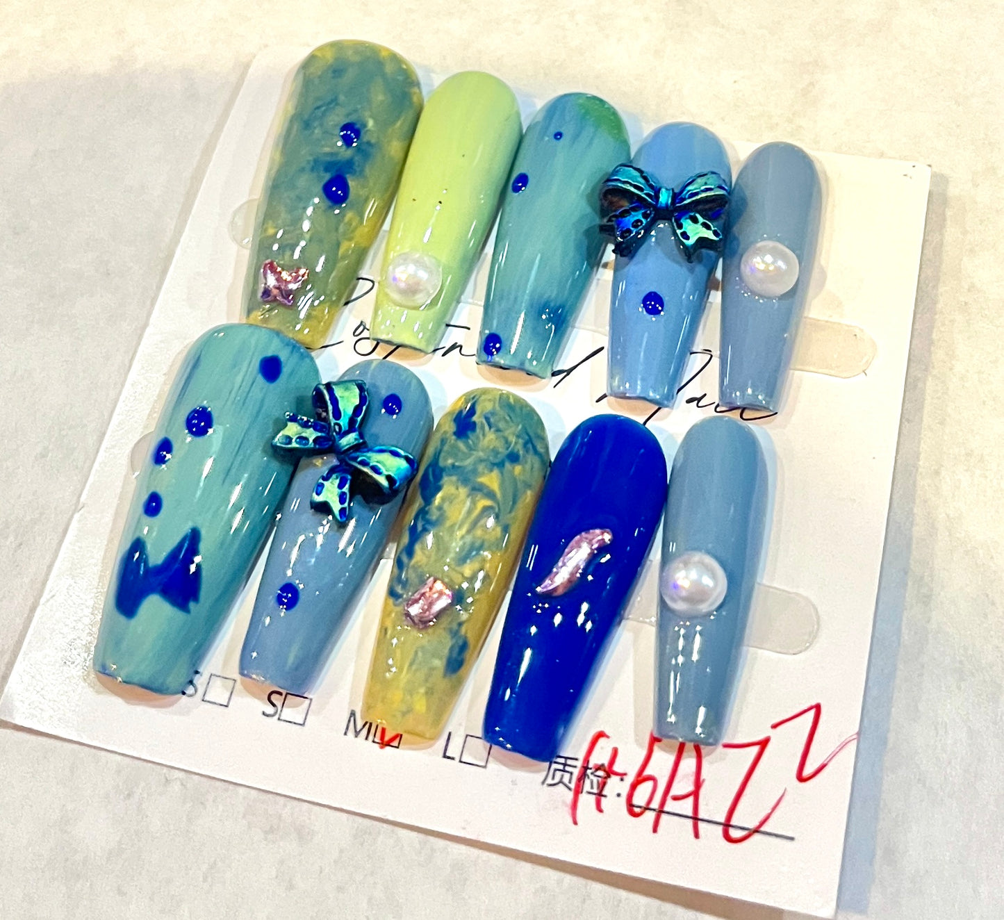 Ocean Mirage – Abstract Blue & Lime Press-On Nails with Butterflies & Pearls